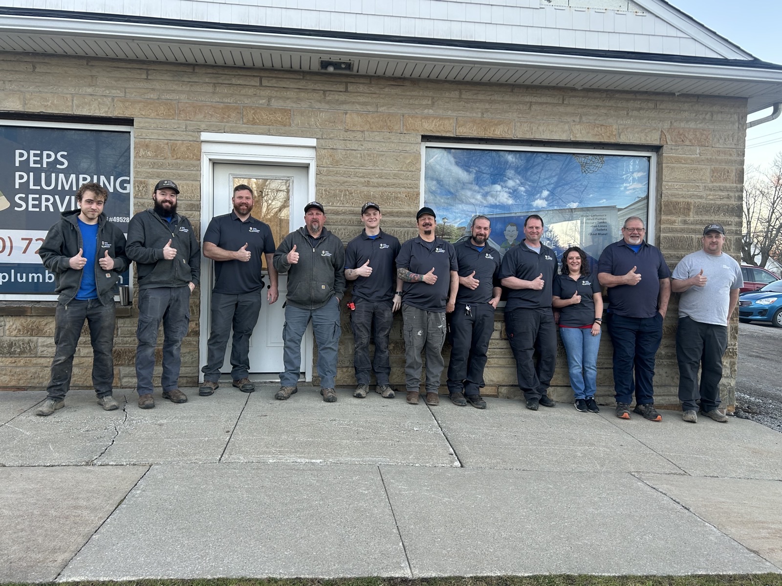 The Peps Plumbing Service team outside the Chardon shop